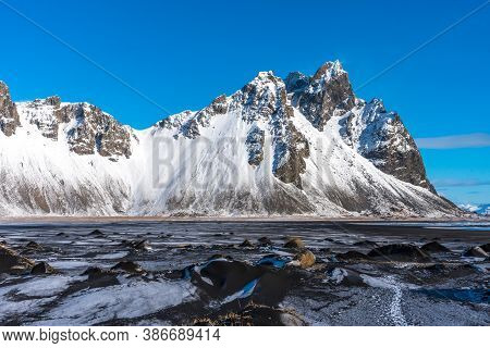 Aerial Winter Landscape View Of Vestrahorn And Black Sand Beach On The Stokksnes Peninsula In Southe