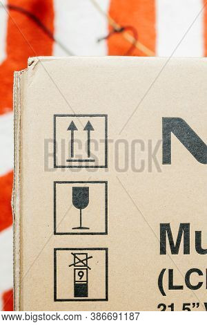 London, United Kingdom - Mar 4, 2014: Multiple Signs On The Cardboard Box Of A Nec Display Computer 