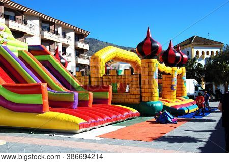 Orgiva, Spain - March 08, 2009 - Bouncy Castle And Slide In The Plaza De La Alpujarra, Orgiva, Spain