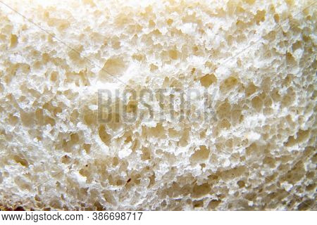 White Bread Background Close-up. Smooth Slice Of Bread, Bread Crumbs, Soft Delicious Loose Bread. Sa
