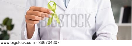 Cropped View Of Doctor Holding Green Awareness Ribbon, Mental Health Concept, Website Header