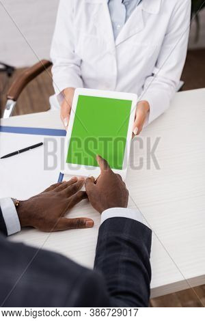 Cropped View Of African American Man Pointing With Finger At Digital Tablet With Green Screen Near D