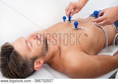Male Sportsman Getting Modern Heart Diagnostic, Heart Rate Measurement, Bradycardia