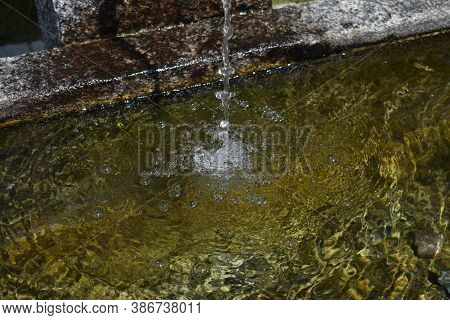 Water Is Flowing In A Fountain In Disentis In Switzerland 8.5.2020