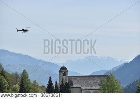 Helicopter Is Flying In The Area Of Disentis In Switzerland 8.5.2020
