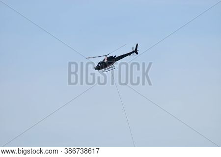 Helicopter Is Flying In The Area Of Disentis In Switzerland 8.5.2020