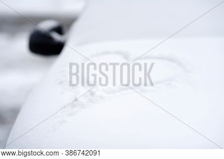 Snow Heart Drawn On The Hood Of The Car. Vehicle Covered Fresh Snow After Overnight Blizzard. Snowdr