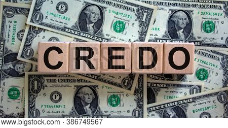 Concept Word 'credo' On Cubes On A Beautiful Background From Dollar Bills. Business Concept.