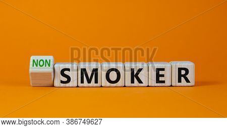 Turned A Cube And Changed The Expression 'smoker' To 'non Smoker'. Beautiful Orange Background. Stop