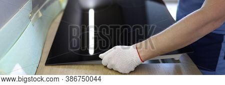 Close-up Of Professional Handyman Setting Cookstove. Male In Protective White Gloves On Kitchen. Mov