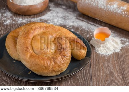 Traditional Turkish Borek Or Turkish Pastry With Minced Meat, Cheese And Spinac On Wooden Background