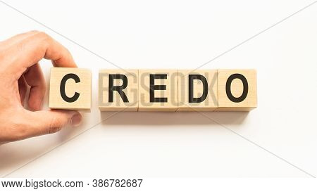 Word Credo. Wooden Small Cubes With Letters Isolated On White Background With Copy Space Available
