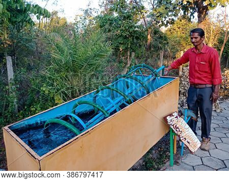 District Katni, India - January 23, 2020: An Indian Science Teacher Presenting Archimedes Screw Mode