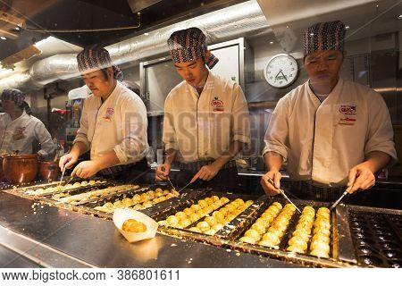 Tokyo, Japan - November 3, 2020 :japanese Chefs Are Cooking Takoyaki In The Restaurant At Akihabara,