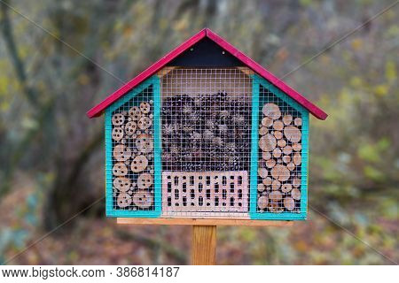 Close Up Of A Colorful Wood Insect House Hotel Structure Created To Provide Shelter For Insects Like