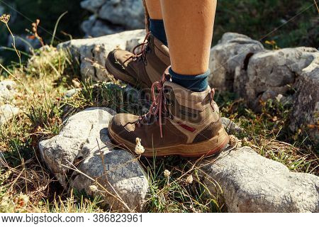 Close Up Of Women Legs Wearing Hiking Boots Stainding In Mountain - Travel And Outdoor Activities Co