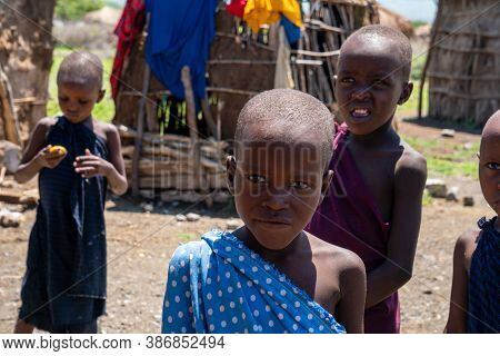 Engare Sero. Tanzania - January 2020: Indigenous Maasai In Traditional Village. Maasailand Is The Ar