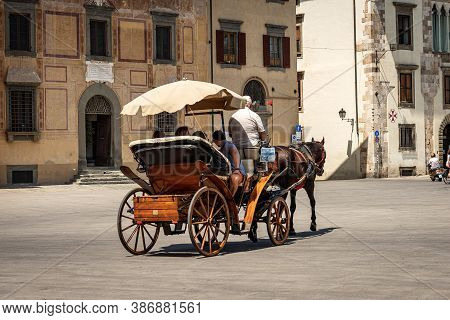 Pisa, Italy - July 29, 2020: Sightseeing Tour In A Horse-drawn Carriage In Pisa Downtown, Square Of 