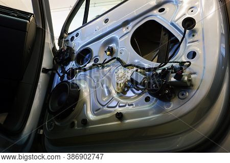 The Inner Lining Has Been Removed From The Door Of A Modern Car. You Can See The Wiring, The Music S