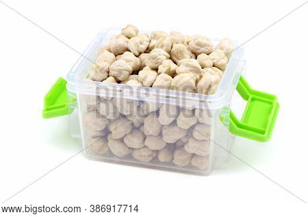Chick-pea In A Plastic Box Isolated On A White Background. Nut Pea Isolated. Vegan Food. Healthy Foo