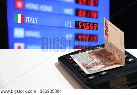 One Thousand Lire Of Italy Banknote On The Calculator On White Floor With Digital Board Of Currency 