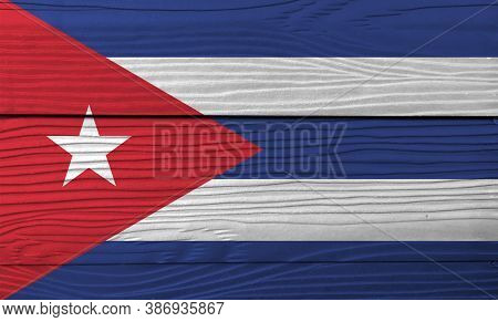 Flag Of Cuba On Wooden Wall Background. Grunge Cuba Flag Texture, Blue And White With The Red Equila