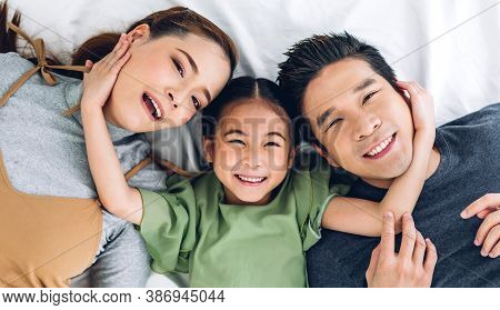 Top View Of Portrait Enjoy Happy Smiling Love Asian Family Father And Mother With Young Parents Litt