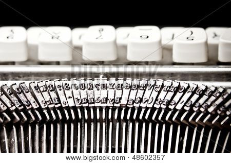 Type Bars And White Buttons Of Typewriter