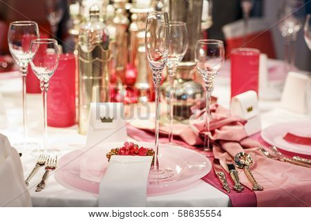 Elegant Table Set In Soft Red And Pink For Wedding Or Event Party.