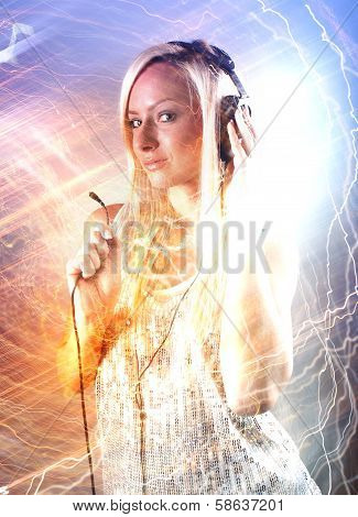 Girl with headphones at the party with lightnings show