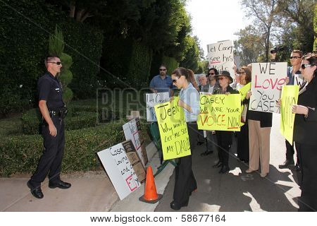 Kerri Kasem and the police at a protest involving Casey Kasem's children, brother and friends who want to see him but have been denied any contact,  Private Location, Holmby Hills, CA 10-01-13