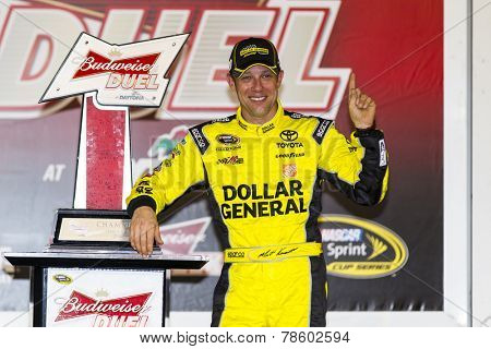 Daytona Beach, FL - Feb 20, 2014:  Matt Kenseth (20) wins the Budweiser Duel at Daytona International Speedway in Daytona Beach, FL.