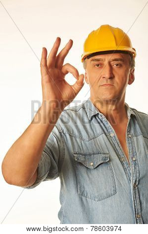 Worker In A Yellow Hardhat Showing Ok Gesture