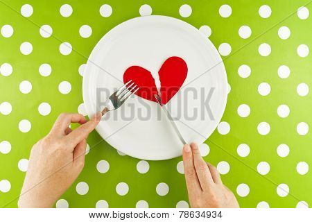 Woman Eating Broken Heart On A White Plate