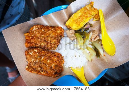 Indonesian Tempe With Rice And Curry Sauce
