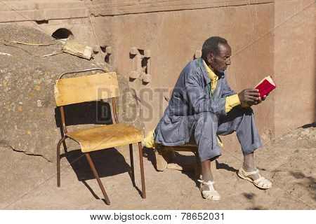 Man reads book in Lalibela, Ethiopia.