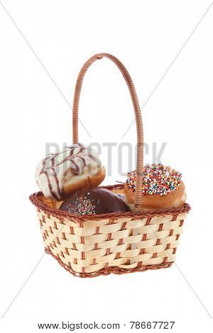 traditional jewish holiday chanuka donuts covered by dark and white chocolate pattern on retro vintage basket isolated on white background