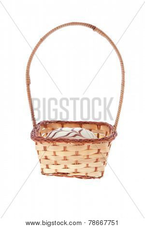 traditional jewish holiday chanuka donuts covered by dark and white chocolate pattern on retro vintage basket isolated on white background