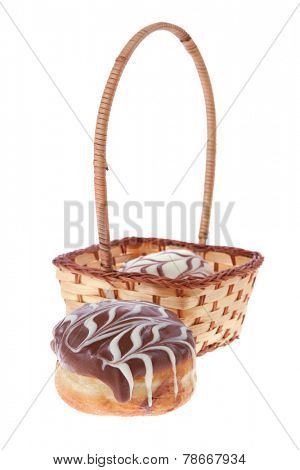 traditional jewish holiday chanuka donuts covered by dark and white chocolate pattern on retro vintage basket isolated on white background