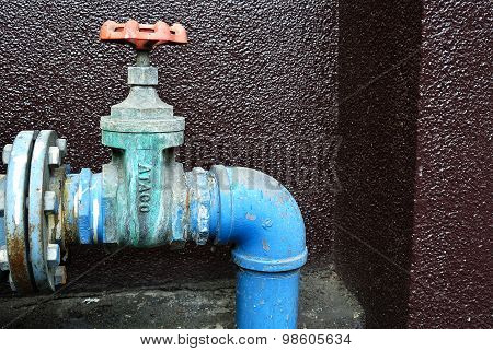 Old or Grunge Rusty Industrial Tap Water Pipe and Valve