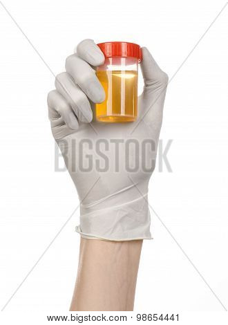 Medical Theme: Doctor's Hand In White Gloves Holding A Transparent Container With The Analysis Of Ur