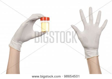 Medical Theme: Doctor's Hand In White Gloves Holding A Transparent Container With The Analysis Of Ur