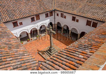Spectacular shot from San Diego church Quito showing rooftops and backyard of building including pla