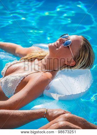 Top view of a  girl in the swimming pool