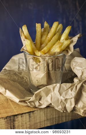 French Fries In A Paper Wrapper, Blue Background