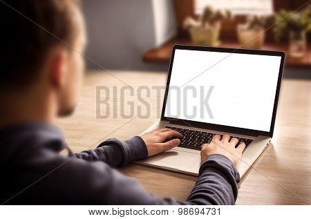 Man using laptop with blank screen - mockup template