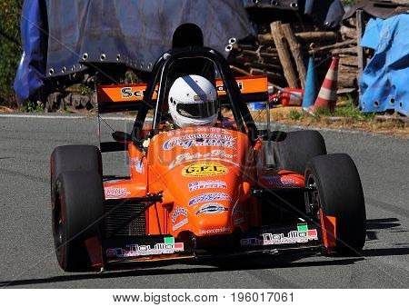 Malvaro Favale Italy - July 16 2017: Uphill Race Race Favale Castello: The F1 racing car type L.R. Conducted Roberto Loda in action on the path
