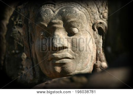 Statues guarding the bridge to Angkor Thom Cambodia