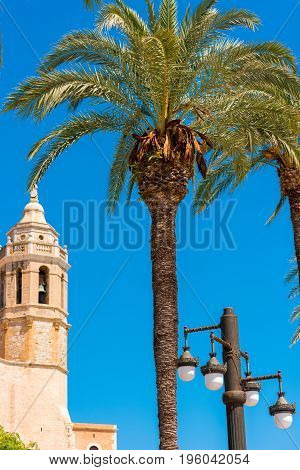 View Of The Tower Of The Church Of Sant Bartomeu And Santa Tecla In Sitges, Barcelona, Catalunya, Sp