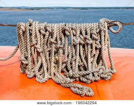 old nautical frayed boat rope on sea. wound up